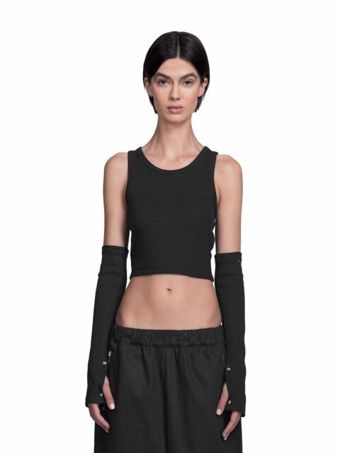 Cropped Front View of Model Vitoria Mota wearing the Radius Arm Warmers Black from BAD PORTIER's OPERATION AW25 capsule.