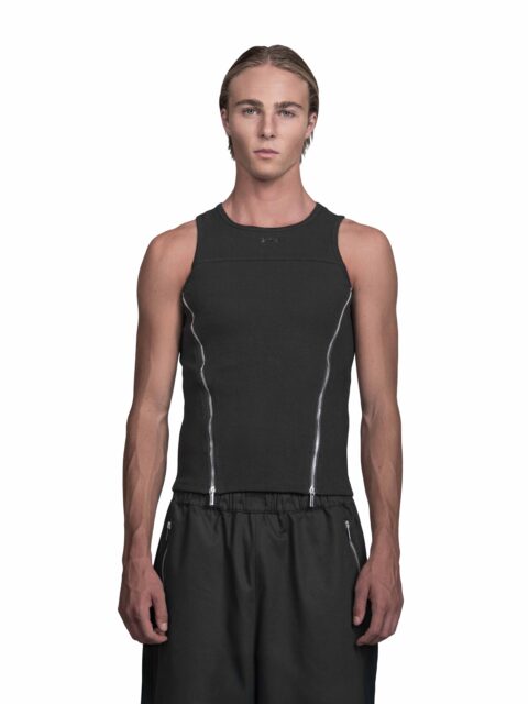 Cropped front View of Model Moritz Ruediger wearing the Sternum Tanktop Black from BAD PORTIER's OPERATION AW25 capsule. Slim cotton tank with two diagonal chrome zippers and panel seams for a sharp V-shape.